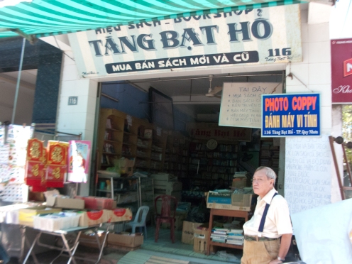 Mr. Thanh in front of his bookshop